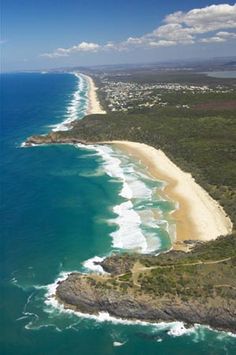 an aerial view of the beach and ocean