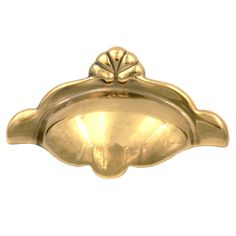 an antique brass door handle on a white background