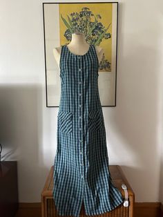 This amazing 100% cotton 90s dress is the perfect transitional dress. You can wear it in summer and also bring it into your fall wardrobe with some cowboy boots and a cute cardigan. It has two pockets in the front with velcro to close them, buttons all down the front and it's sleeveless. Size small (S). NO RETURNS. Cotton Maxi Dress With Relaxed Fit, Retro Cotton Midi Dress For Summer, Cotton Retro Midi Dress For Summer, Summer Cotton Midi Dress For Picnic, Fitted Cotton Maxi Dress For Picnic, Retro Cotton Dress For Day Out, Cotton Relaxed Fit Sundress Midi Dress, Fitted Cotton Midi Dress For Picnic, Retro Summer Maxi Dress For Daywear