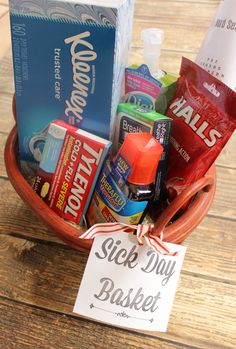 a basket filled with different types of items and the words sick day basket written on it