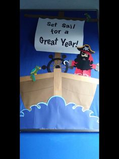 a bulletin board with an image of a pirate ship and a sign that says set sail for a great year