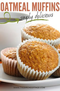 three muffins sitting on top of a white plate next to a cup of coffee