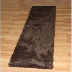 a brown rug is laying on the floor