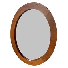 a round wooden mirror is shown against a white background