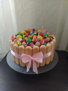 a birthday cake decorated with candies and candles