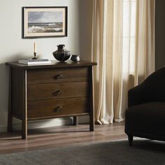 a living room scene with focus on the dresser