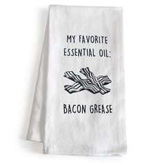 a tea towel that says, my favorite essential oil bacon grease