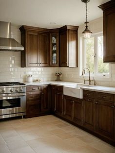 a kitchen with wooden cabinets and stainless steel appliances in the center, along with white tile flooring