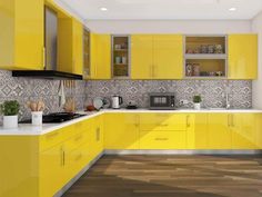 a kitchen with yellow cabinets and white counter tops