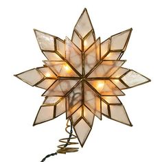 a lighted snowflake decoration on a white background