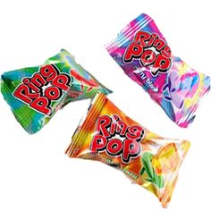 three colorful candy bars sitting next to each other on a white surface with the word ring pop printed on them