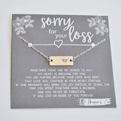 a card with a message on it that says sorry for your loss and a heart