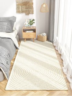 a bed room with a neatly made bed and a white rug on the wooden floor