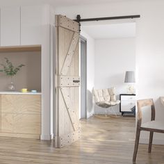 an open sliding door in the middle of a room with wooden floors and white walls