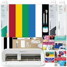 an assortment of crafting supplies including a cricut machine