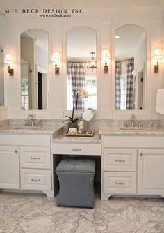 the bathroom is decorated in white and gray