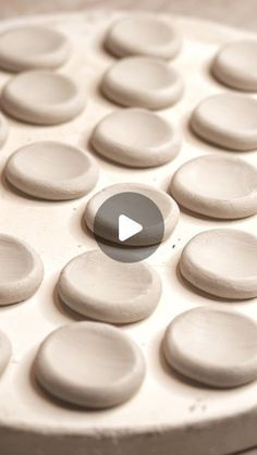 a close up of an object made out of white clay with circles on the surface