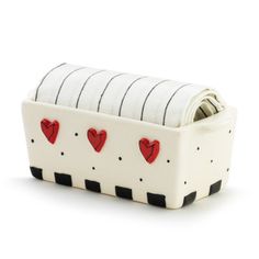 a white and black box with red hearts on it