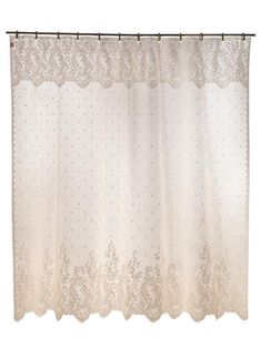 a white shower curtain with lace on it