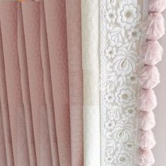 pink curtains with white lace and flowers on them