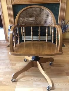 a wooden chair sitting on top of a hard wood floor