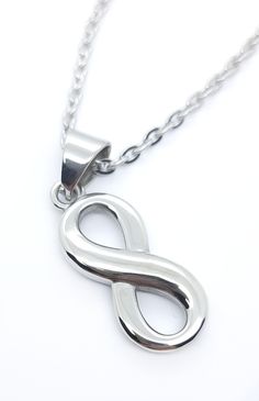 Infinity necklace. Figure of 8 infinity necklace. stainless steel necklaces. Silver colour. Quality 316L stainless steel. 3mm cable chain. Lobster claw clasp. We only use premium 316L stainless steel in our jewellery (we never use cheap alloy substitutes). Stainless steel is is a great choice for jewellery. It is durable, tarnish and scratch resistant, waterproof, hypoallergenic (more so than silver), shiny and affordable.  All our products come gift wrapped in jewellery pouch and tissue paper at no extra charge. We aim to dispatch same day where possible. Arrival dates are estimates so please understand when occasionally shipping services have delays that are outside our control. If you want to track your delivery there is the option to upgrade to 'tracked' at checkout. Otherwise we use s Infinity Necklace Silver, Jewellery Pouch, Necklaces Silver, Infinity Design, Infinity Pendant, Infinity Necklace, Chain Fashion, Silver Colour, Stainless Steel Necklace