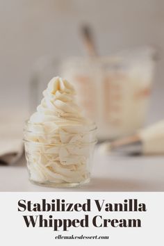 vanilla whipped cream in a small glass jar with the words, stabilized vanilla whipped cream