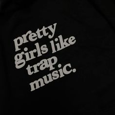 the words pretty girls like trap music printed on a black hoodie