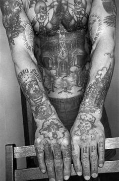 a man with many tattoos on his arms