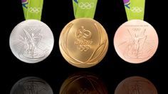 four olympic medals are shown in three different colors