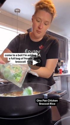 a woman cooking in a wok with broccoli being cooked on the stove