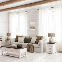 a living room filled with furniture and white walls