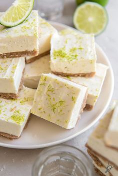 there are many pieces of lime cheesecake on the plate and one slice is cut in half