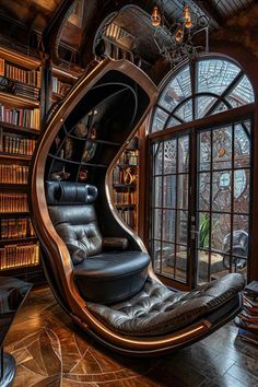 a chair that is in front of a book shelf with many books on the shelves