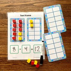 the ten frame game is displayed on a table with markers and pencils next to it