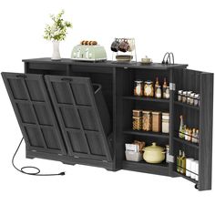 an open cabinet with food and drinks on the top, next to a potted plant