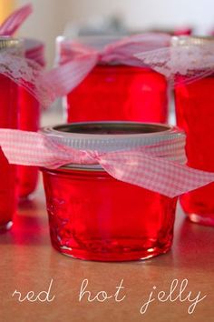 red hot jelly jars with pink bows on them