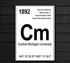 a sign on the side of a brick wall that says central michigan university, 1932