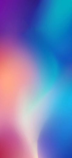 an abstract blurry background in blue, pink and orange