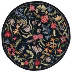 a round rug with flowers and leaves on the inside, in black color is shown