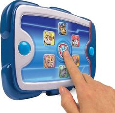 a child's hand touching the screen of a toy tablet