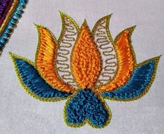 a close up of an embroidered object on a table