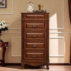 a small chest of drawers in a room