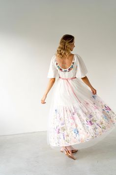 Floral linen wedding dress with colorful wildflower embroidery. Timeless design with flowy and flattering skirt. Warm colored off white dress with pop of greens and bright florals. Dress is made of natural materials to ensure you will feel very comfortable. Special embroidery techniques add volume, shading and textures.  Every dress is made to order and is similar but unique.  Limited floral collection❗️ DETAILS: ▪️ TOP - ivory double layered European 100% linen - Oeko Tex certified ▪️ SKIRT - 100% linen - Oeko Tex certified ▪️ tulle as second skirt layer ▪️ colorful embroidery floral motifs ▪️ zip fastening on side ▪️ velvet trim to tie on back  ▪️ low back design (depth can be adjusted according to your preferences)      *pockets can be added upon request 📍Please note that colors may va Embroidered Floral Wedding Dress, Wedding Dress Colorful, Garden Wedding Dress, Wedding Dress Rustic, Wildflower Embroidery, Wedding Dress Open Back, Linen Wedding Dress, Rustic Garden Wedding, Linen Wedding