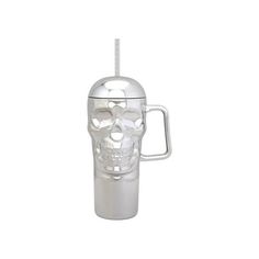 a glass cup with a skull on the side and a straw sticking out of it