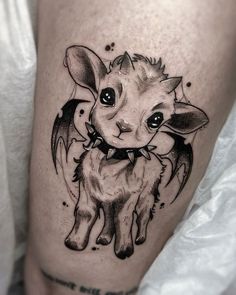 a small goat tattoo on the leg