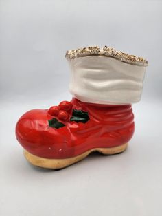 a red shoe with a white hat on top