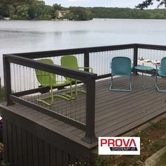 two chairs on a deck overlooking the water