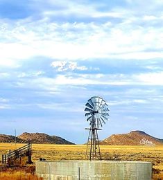 an old windmill in the middle of nowhere