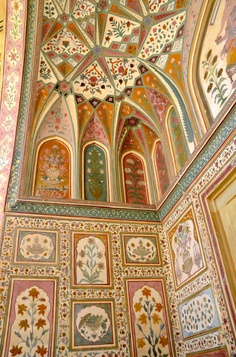 an intricately painted ceiling in the middle of a room